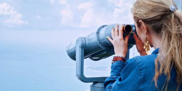 girl-sea-binoculars-vacation