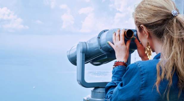 girl-sea-binoculars-vacation